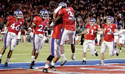 kansas-aqib-talib-3-celebrates-with-teammates-after-returning-an-interception-for-a-touchdown-during-the-jayhawks-victory-over-virginia-tech-in-thursdays-orange-bowl-in-miami-it-was-kansas-first-major-bowl-appearance-since-it-played-in-the-1969-orange-bowl