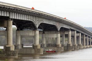 searchers-comb-the-arkansas-river-under-the-interstate-430-bridge-for-missing-workers-that-fell-into-the-river-when-the-scaffold-they-were-working-on-collapsed