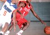 Micha Delph (right) of the Arkansas Wings-Elite tries to get around Houston Flight's Joshua Jones on Friday during the AAU Division II 16-under National Championship semifinals.
