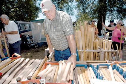 bob-helton-looks-through-an-assortment-of-wooden-handles-to-be-used-as-replacements-for-hammers-axes-and-other-tools-while-hitting-the-sales-in-kenwood-during-the-2007-bargains-galore-on-64-event