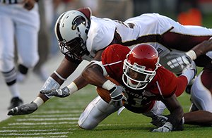 michael-smith-dives-for-yardage-against-the-university-of-louisiana-monroe-at-the-war-memorial-stadium-in-little-rock