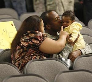 sgt-jermell-heath-middle-of-houston-spends-time-with-his-wife-joeanna-and-6-month-old-daughter-jenesis-on-wednesday-night-during-a-welcome-home-ceremony-at-camp-shelby-miss-heath-was-returning-home-from-a-deployment-to-irag-with-a-troop-151-cavalry-regiment