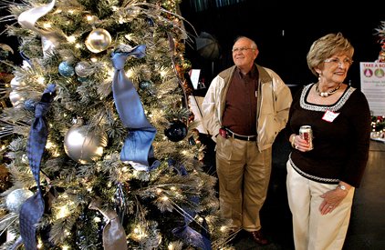 carti-auxiliary-members-ernestine-grooms-right-and-her-husband-ken-grooms-tour-a-field-of-trees-inside-the-clear-channel-metroplex-in-little-rock-during-festival-of-trees-in-this-2006-file-photo