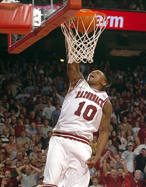 Marcus Monk dunks the ball on a fast break during Tuesday's game against Oklahoma at Bud Walton Arena in Fayetteville.