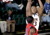North Pulaski's Aaron Cooper attempts a three-pointer over Helena-West Helena Central's Justin Fitzgerald during Tuesday's first-round game at the Class 5A state tournament in Alma. Cooper led all scorers with 24 points. Fitzgerald had 11.