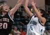 Springdale Har-Ber's Taylor Stites has his shot blocked by Russellville defender Brent Klein during Thursday's Class 7A state playoff game at the Stubblefield Center in Fort Smith.
