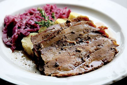 roasted-pork-shoulder-is-dressed-up-with-braised-red-cabbage-and-czech-potato-dumplings-at-the-pantry