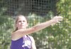 Fayetteville's Caroline McCombs unleashes a discus throw during the first day of state high school heptathlon at Cabot. McCombs, who is third after the first day with 2,917 points, was eighth-best in the discus, but had the top distance in the long jump with 17 feet, 9 inches.