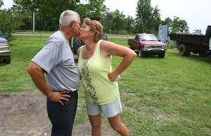 ruby-kersten-gives-her-husband-david-a-kiss-before-leaving-for-work-as-a-pope-county-jailer-she-showered-at-work-because-she-says-she-always-runs-out-of-warm-water-using-the-trailers-shower