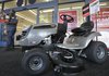 A shopper walks past a lawn tractor for sale at Sears Grand in Solon, Ohio on Tuesday.