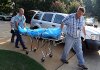The body of Todd Bostian is removed from near the home at 144 Blue Heron Drive on Lake Hamilton in Hot Springs on Friday morning.