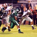 Muskogee's Robert Thomas sacks Tulsa Union running back Jeremy Smith during first half football acti...