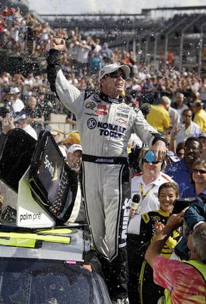 Jimmie Johnson revels after his victory over teammate Mark Martin (Batesville) in the Allstate 400 at the Brickyard at the Indianapolis Motor Speedway in Indianapolis on Sunday.