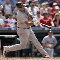 Albert Pujols of the St. Louis Cardinals strikes out swinging on a pitch from Philadelphia Phillies ...