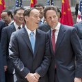 Wang Qishan (left), China's vice premier, visits with Treasury Secretary Timothy Geithner on Monday ...