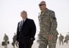 U.S. Defense Secretary Robert Gates, left, walks to his plane with the top US commander in Iraq, Gen. Ray Odierno as he prepares to depart Baghdad to Irbil.