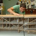 University of Arkansas architecture student Nick Walker sets up one of the Fayetteville High School ...