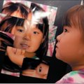 Hallie Ryan, 7, got to take her photo collage done in the style of artist David Hockney after the Ar...