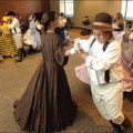 Moving history:
Jim Threet, 11, does the Virginia Reel dance with Christina Wilkerson, 13, and othe...