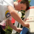 <b>Fibrosis Foundation.<b>
Trey Stacy, 9, who has cystic fibrosis, worked Sunday at his annual job ...
