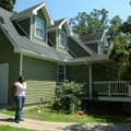 Shaniqua Ray, Youth Bridge case manager, shows off the new paint job volunteers completed a few week...