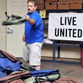 Volunteer Jason Williams sorted backpacks filled with school supplies that the Samaritan Community C...