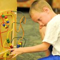 <b>Summer afternoon at the library</b>
Declan Baldwin, 6, worked a moving-bead puzzle in the Childr...