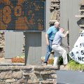 <b>Feeling the heat</b>
Bob Patton, left, and Dane Addington put up a sign for Decatur State Bank's...