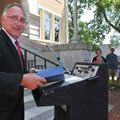 Benton County Judge Dave Bisbee read a proclamation outside the Benton County Courthouse on Tuesday ...
