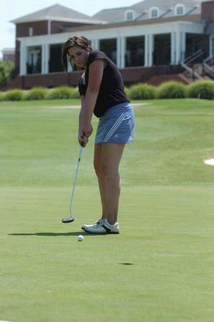 Fayetteville High School junior Alex Del Sol putts on the ninth green during the Springdale High School Bulldog Invitational Tuesday at the Springdale Country Club.