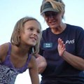 Olivia Castleman, 8, stomps a tub of grapes as Kim Umber cheers her on during the Grape Stomp Tuesda...