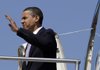 President Barack Obama waves as he steps off Air Force One at Michiana Regional Airport in South Bend, Ind., Wednesday.