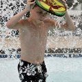 <b>Looking for cover</b> 
Trent Stacy, 11, of Bella Vista covered his head while he ran under a mus...