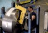 Derek Jenkins, a Baldor Electric Co. employee, moves a large roll of steel inside the company's factory in St. Louis on June 3. Factory orders rose in June for the fourth time in five months, according to the Commerce Department. Analysts had forecast a 1 percent decline.