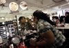 Sheika Smith applies makeup at a J.C. Penny store cosmetics counter in New York City in July, a lackluster month for retailers.