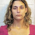 In this police booking photo provided by the Conway County Sheriff's office in Morrilton, Ark., Ambe...