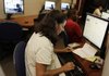 Zina Mixx, 44, who is homeless, completes a job application Thursday in Homestead, Fla.