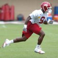 Arkansas sophomore free safety Elton Ford (9) works out on the first day of fall practice Thursday a...