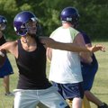 Elkins quarterback Robert Teaque targets a receiver Wednesday in Elkins during practice.