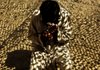 A suspected Taliban member captured by U.S. troops is interrogated Saturday in Afghanistan's Wardak province. U.S. forces are redeploying in southern Afghanistan to keep the Taliban from disrupting the Aug. 20 presidential election. 