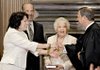 Sonia Sotomayor is congratulated Saturday by Chief Justice John Roberts after taking the oath to become the nation's first Hispanic Supreme Court justice. She is joined by her brother, Juan Luis Sotomayor, and her mother, Celina Sotomayor.