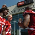 Arkansas sophomore quarterback Ryan Mallett (15) jokes with freshman wide receiver Cobi Hamilton (11...