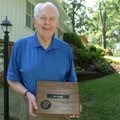 Former referee Bob Renner received a plaque after being inducted into the Arkansas High School Coach...