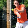 <b>Tennis for charity</b>
Dustin Conwill of Rogers returns a shot Sunday during his doubles match w...