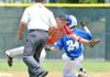 McComb (Miss.) shortstop Landon Nettles dove to knock down a wide throw from the catcher as Bryant's Jonathan Lyman stole second base during Monday's game at the 13-year-old Babe Ruth Southwest Regional Tournament at Phillips Park in Bentonville. McComb scored two runs in the bottom of the seventh to win 7-6. Thunderstorms in the area postponed Monday's remaining two games. 
