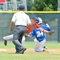 McComb (Miss.) shortstop Landon Nettles dove to knock down a wide throw from the catcher as Bryant's...