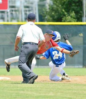 McComb (Miss.) shortstop Landon Nettles dove to knock down a wide throw from the catcher as Bryant's Jonathan Lyman stole second base during Monday's game at the 13-year-old Babe Ruth Southwest Regional Tournament at Phillips Park in Bentonville. McComb scored two runs in the bottom of the seventh to win 7-6. Thunderstorms in the area postponed Monday's remaining two games. 