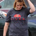 <b>Book for cover</b>
To help cover her from the rain, Jena Ramsey, 18, of Bentonville held a book ...