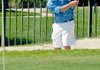 Rogers junior Jake Rylee blasted out of a sand trap at the par-3 8th hole during Monday's golf match against Fayetteville.