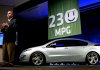 Fritz Henderson, president and chief executive officer of General Motors, announces the predicted mileage for the Chevrolet Volt electric car at the company's Technical Center in Warren, Michigan, on Tuesday, Aug. 11, 2009.